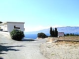 Ravdoucha. Village left, seaside and tavernas right.