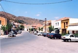 Kolimbari x-roads, war memorial, bear left. Seafront Tavernas on right. 